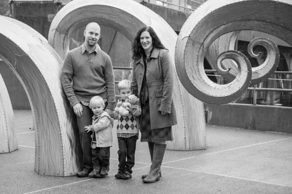 Family portrait, next to Salmon Waves sculpture at Ballard Locks