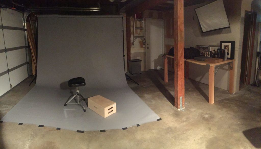 photo of a photography studio with stool and table.