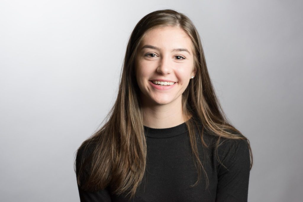 headshot photo of a young girl with long brown hair