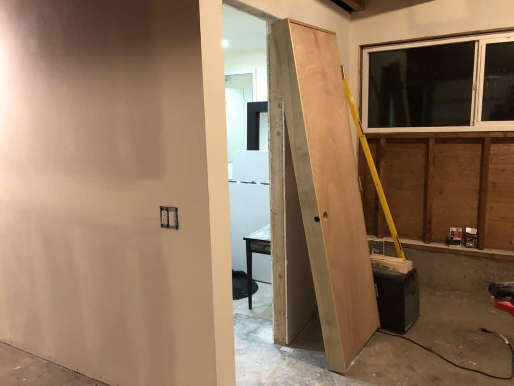 photo of an unfinished studio with door missing