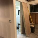 photo of an unfinished studio with door missing