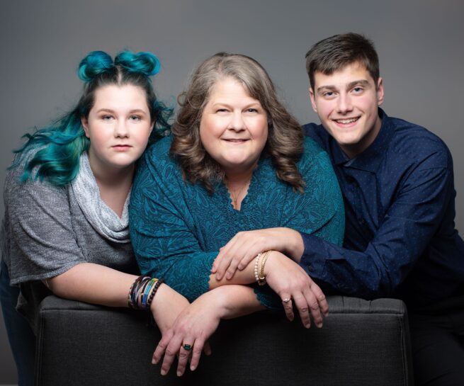 studio family portrait of mother daughter and son