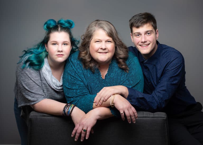 studio family portrait of mother daughter and son