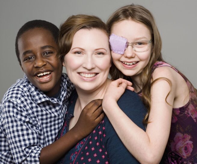 studio portrait of mother daughter and son