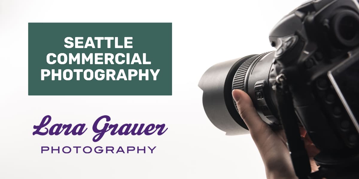 hand pointing a professional photographers camera at text that reads, seattle commercial photography, Lara Grauer photography