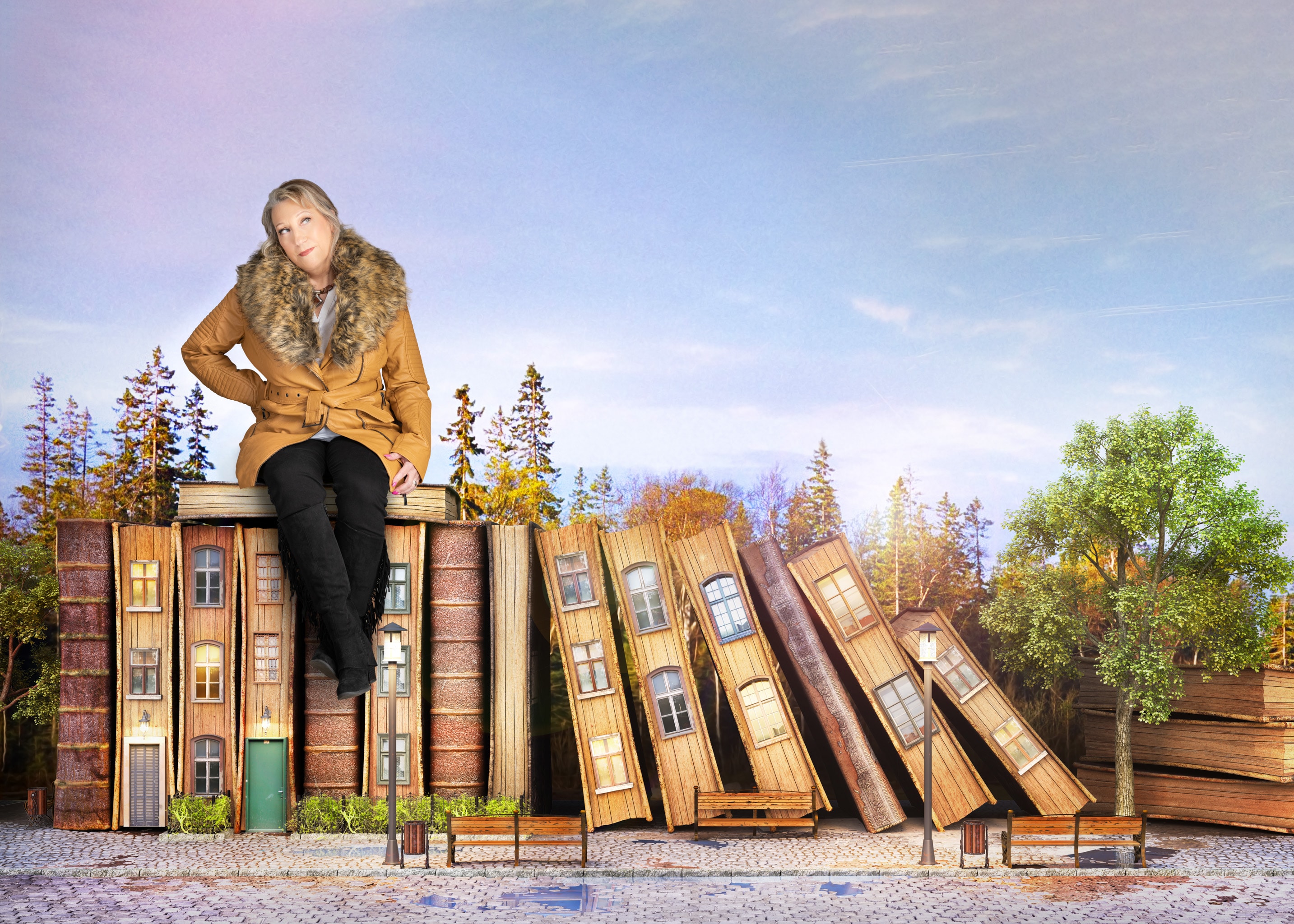 Fantasy image of woman sitting on street scene made of old books