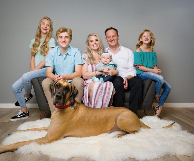 Family portrait with large Great Dane, dog.