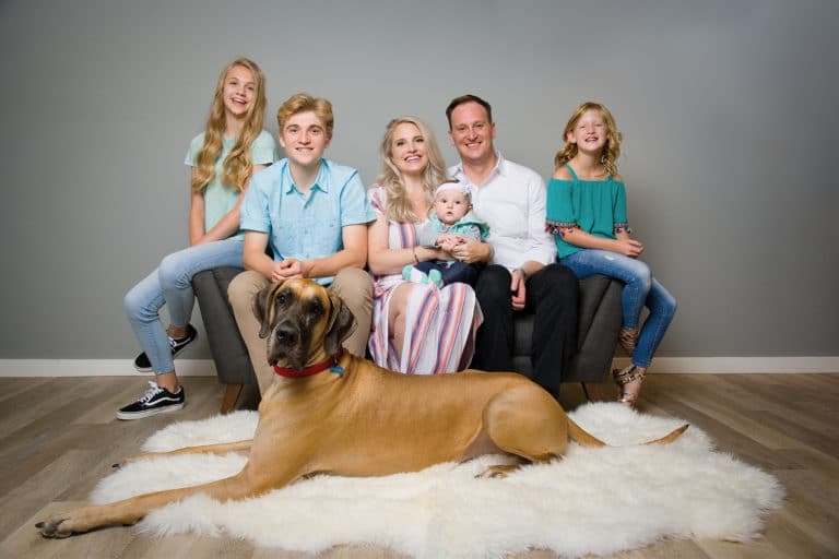 Family portrait with large Great Dane, dog.