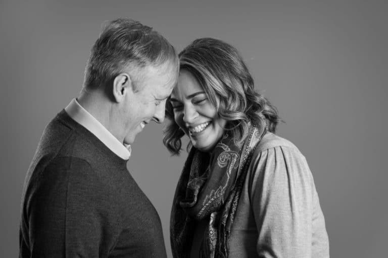 Black and white photo of a laughing couple