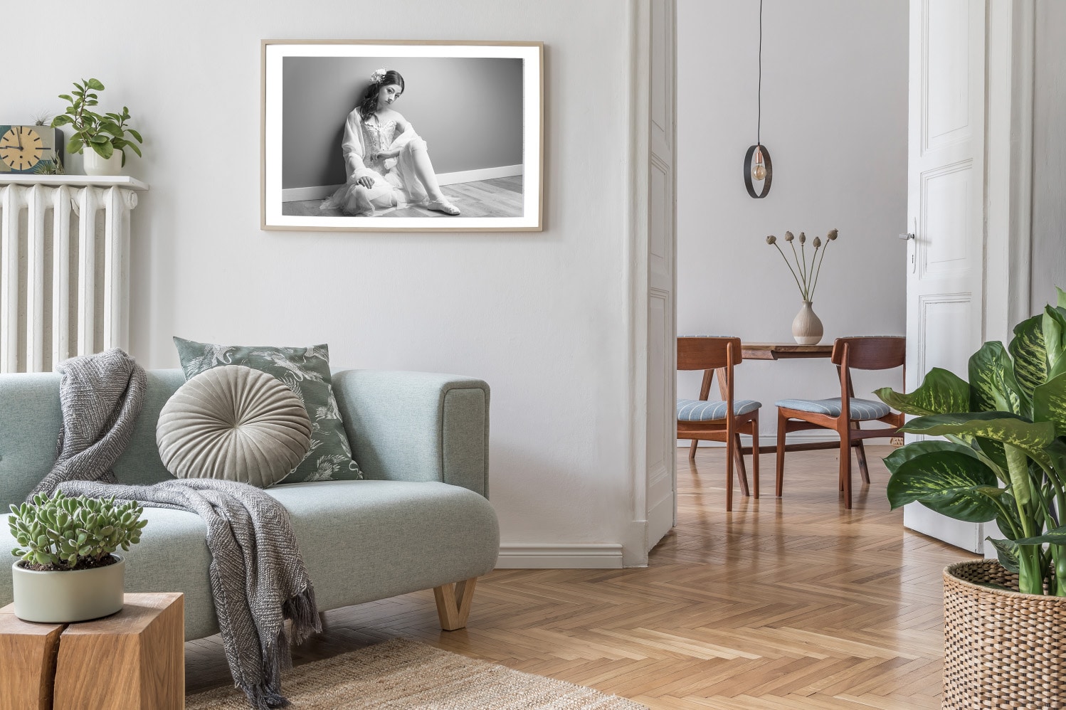 Portrait of a ballerina hanging on the wall in a white living room