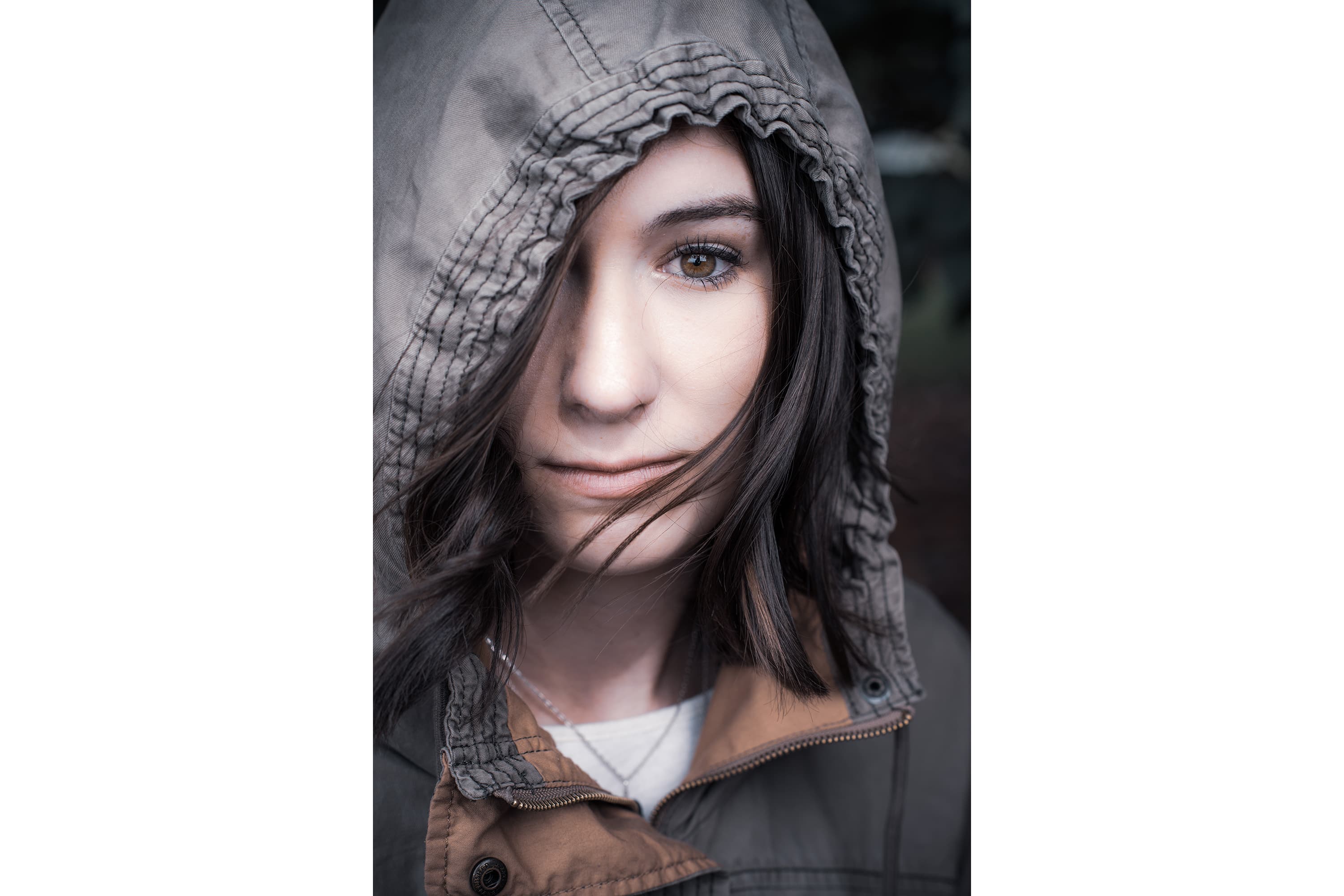 Portrait of a women wearing a hood covering part of her face