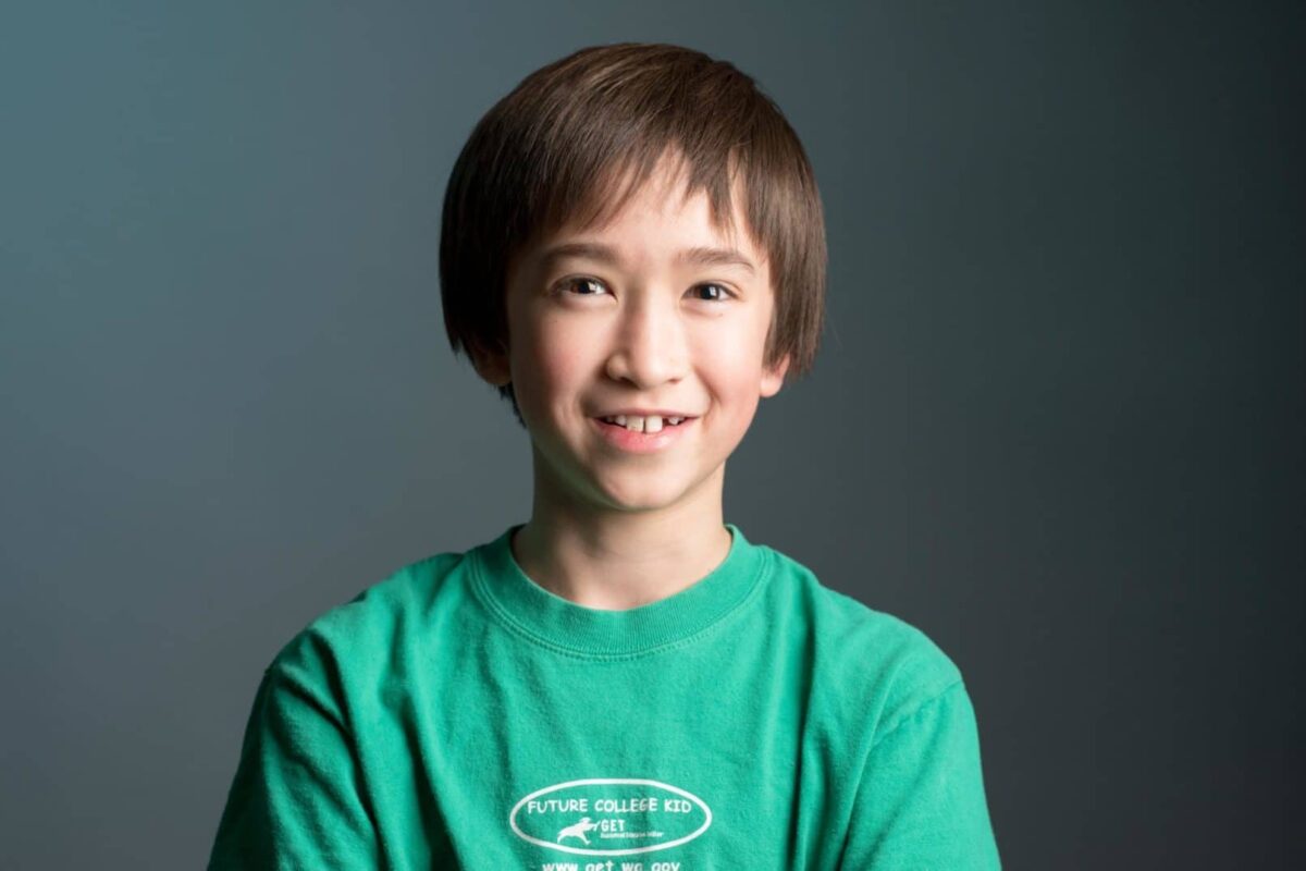 Young boy posing for headshot photo.