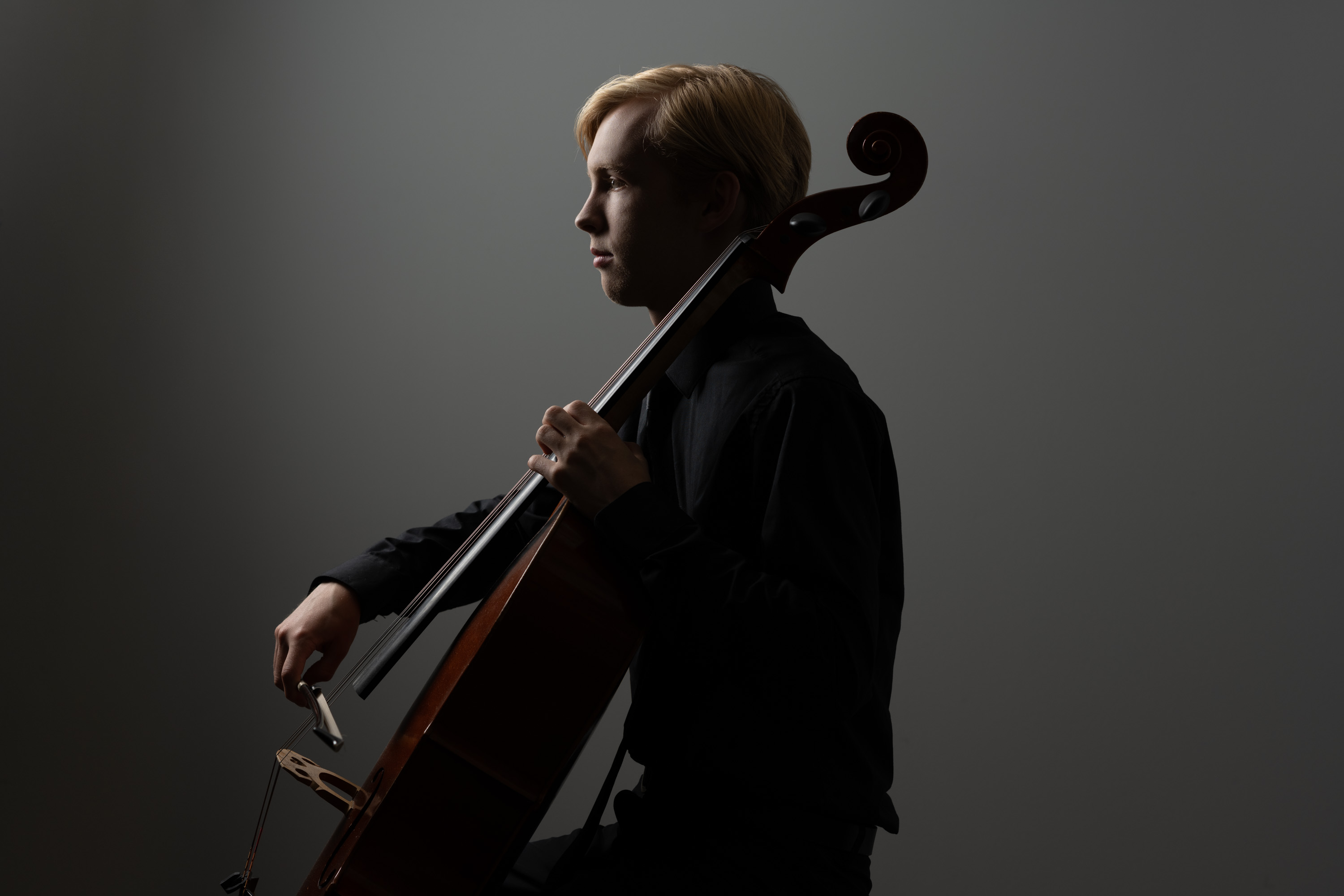 Header photo of high school boy with cello
