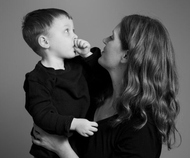 Black and white portrait of a mother an her son as seen in Lara Grauer Photography's portfolio