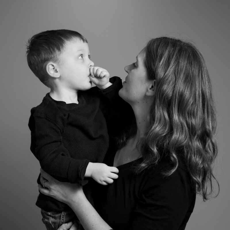 Black and white portrait of a mother an her son as seen in Lara Grauer Photography's portfolio