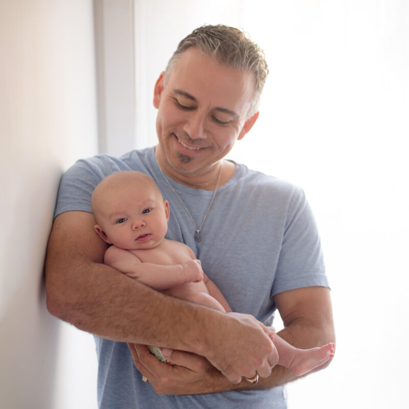 Father in blue with baby Portfolio image of a dad with his baby seen on Lara Grauer Photography