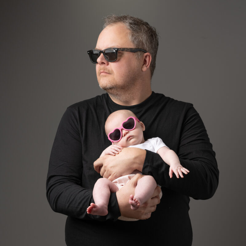 Father with baby daughter in sunglasses Color portrait part of portfolio of Lara Grauer Photography